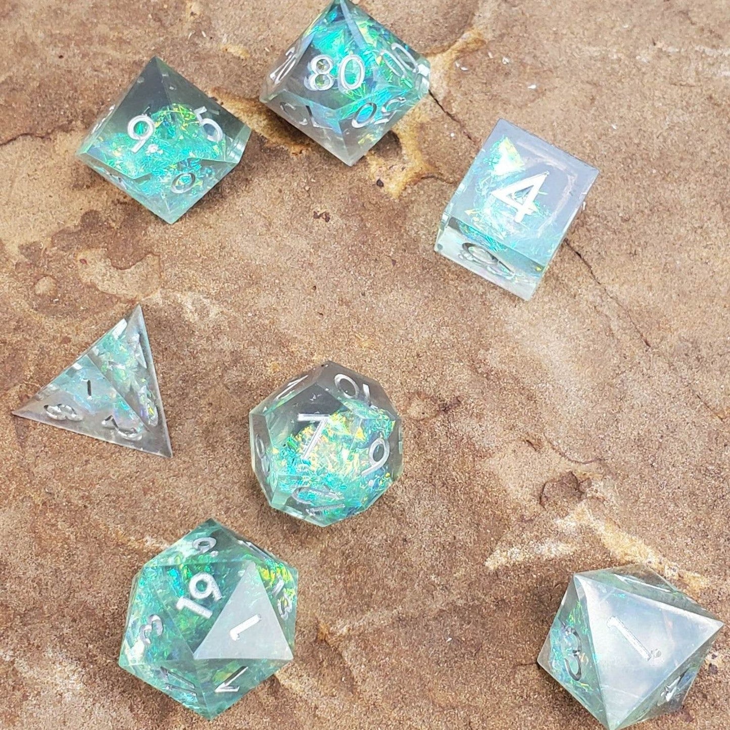 Sharp Edge Glimmer Green Resin Dice Set with Silver Numbering