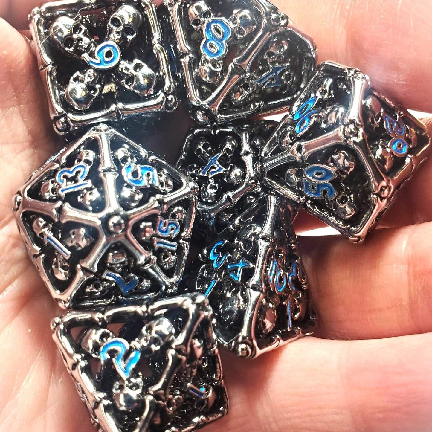 Hollow Bone & Skull Metal Dice Set with Blue Numbers